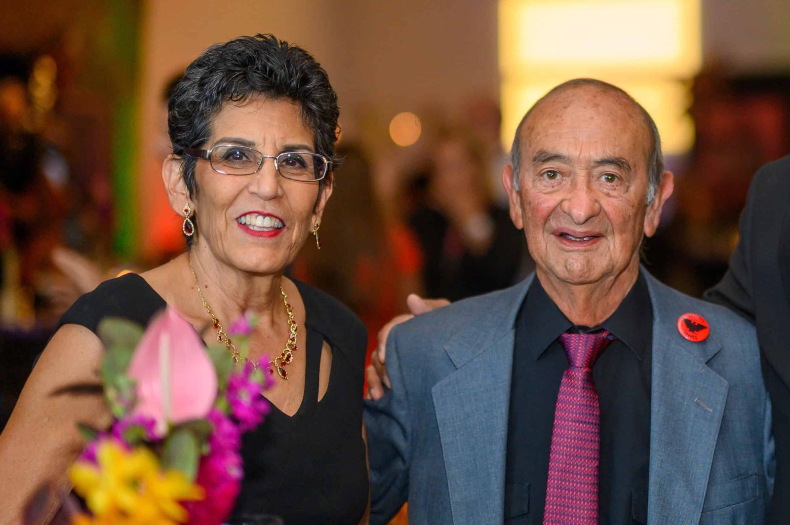 A man and woman standing next to each other.