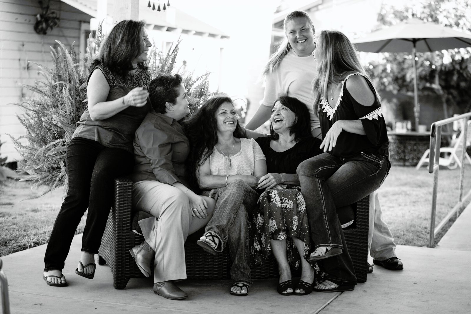 A group of people sitting on top of a couch.