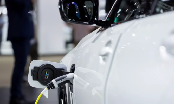 A close up of an electric car charging