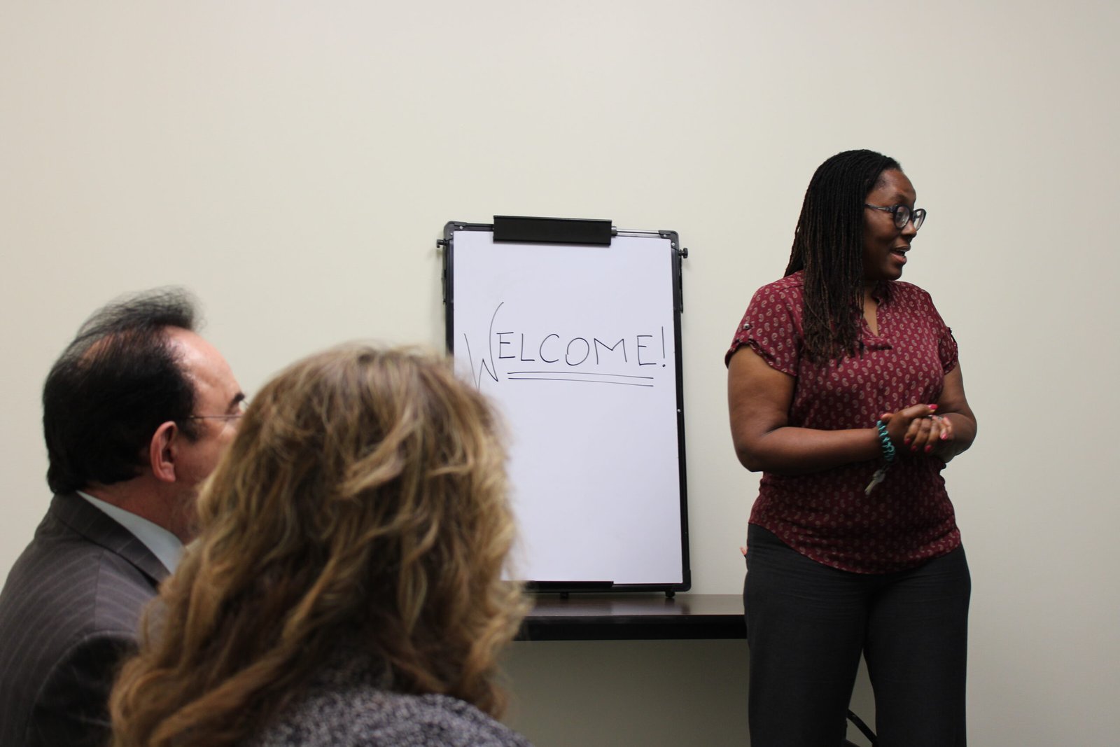 DUI welcome A woman standing in front of a flip chart.
