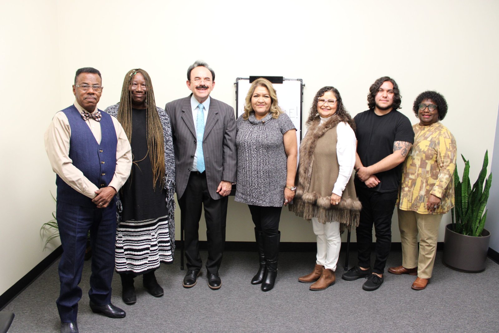 DUI program workers A group of people standing in front of a wall.