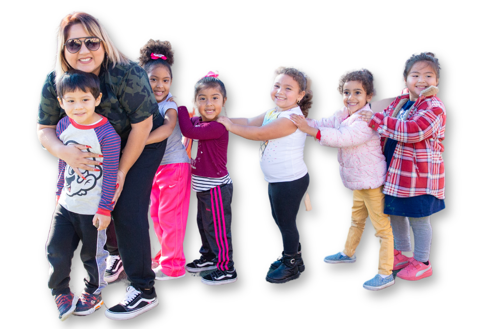 MAAC childcare worker with kids on playground A group of children standing next to each other.