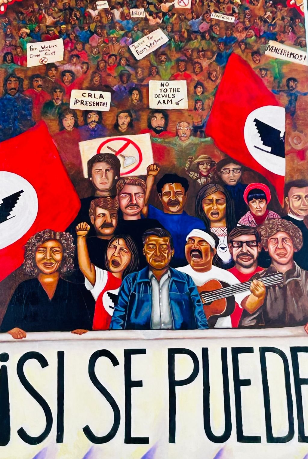 A painting of people with signs and flags.